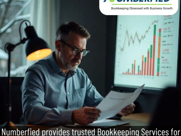 Accountant reviewing spreadsheets to manage taxes and payroll with accounting and bookkeeping services USA.