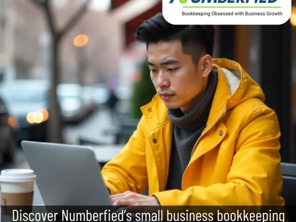 A man sitting at a desk with a laptop and a cup of coffee, working on financial records — representing small businesses bookkeeping services.