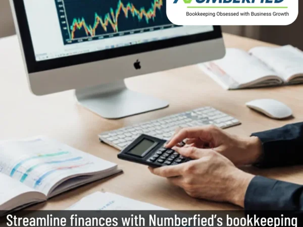 Numberfied’s accountant reviewing documents for bookkeeping and tax services contract accounting.